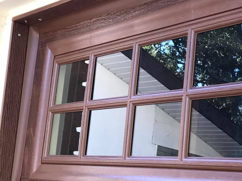 Beautiful new wooden garage door with windows
