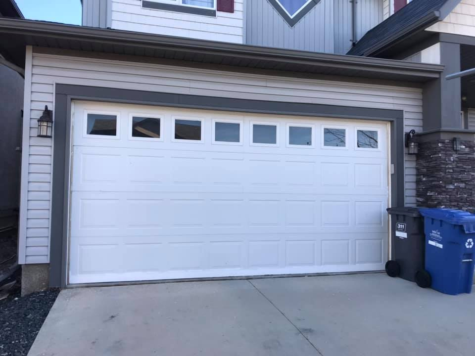 Beautiful new white garage door with windows