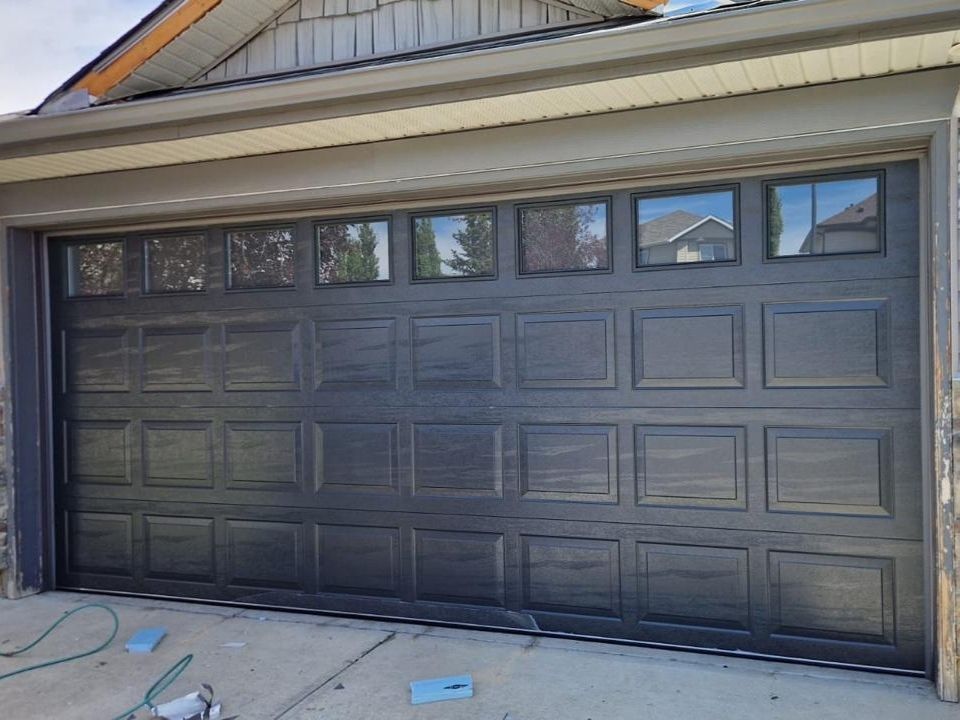 Beautiful new wooden garage door with windows