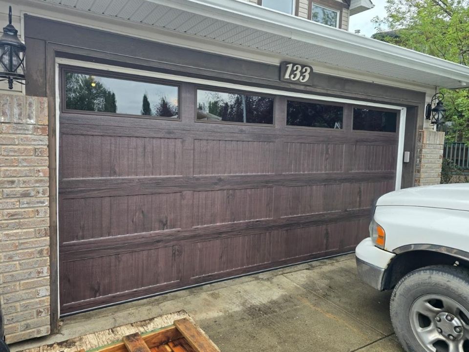 Beautiful new wooden garage door with windows