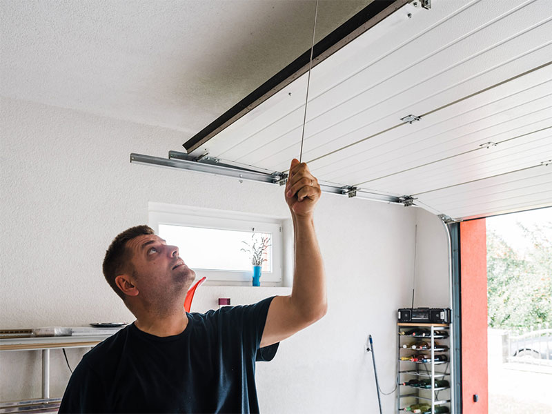 Featured image for “Why Is DIY Garage Door Repair Dangerous?”